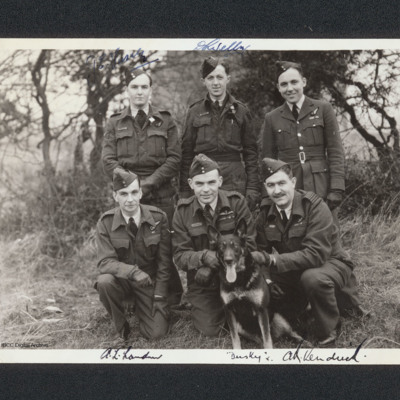 Six aircrew with dog