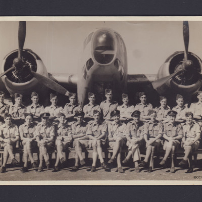 Group of airmen in front of a Hudson