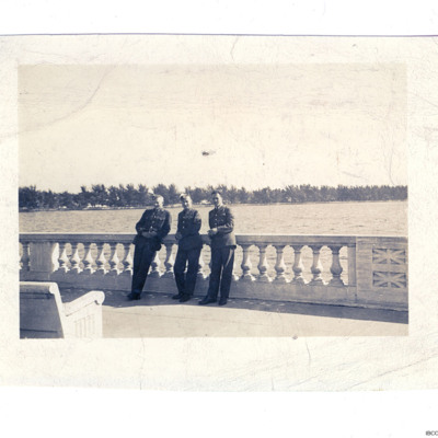 Three RAF personnel by a lake
