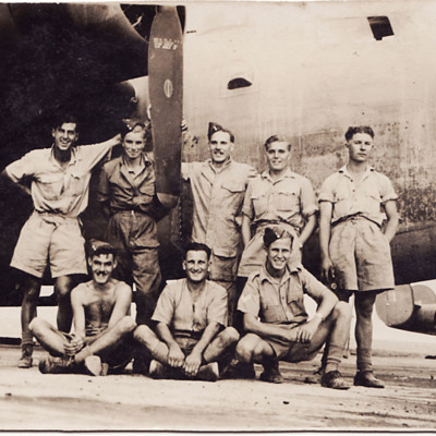 Eight groundcrew with B-24