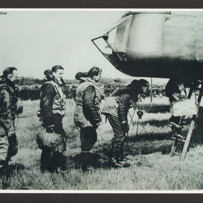 Five aircrew climbing aboard a Whitley