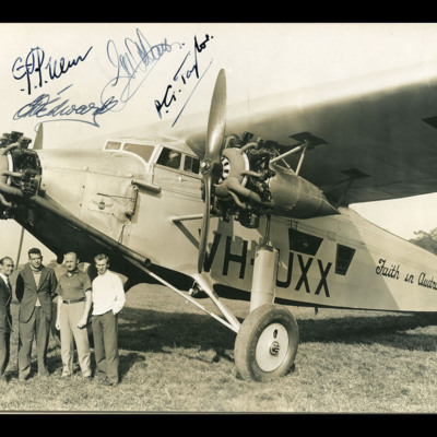 Four men in front of an Avro Ten