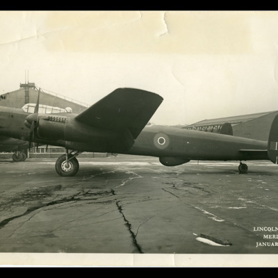 Avro Lincoln parked on pan by hangar