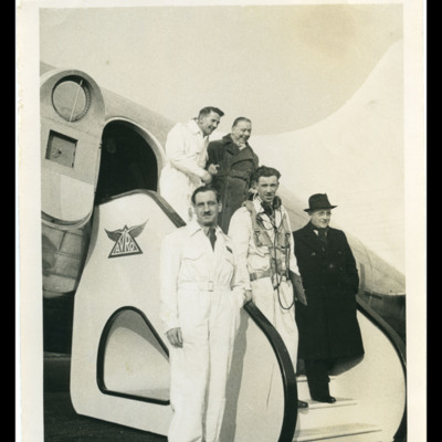Roy Chadwick and four men on steps by door of aircraft