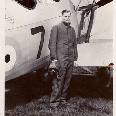 Pilot standing by aircraft