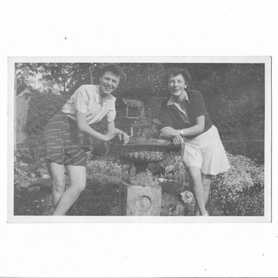 Eva Akenhead and Peggy Johnson in a garden