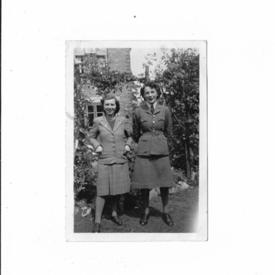 Mollie Wray and Peggy Johnson standing in garden