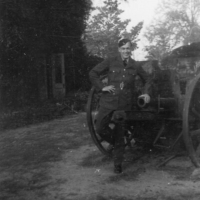 Airman standing by a cannon