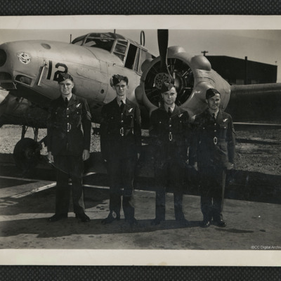 Four navigators in front of an Anson
