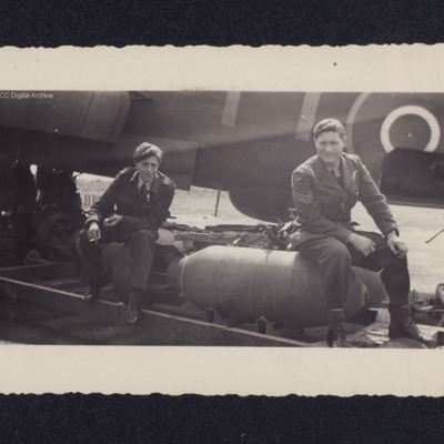 Airmen sitting on bombs