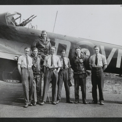 Airmen standing by a Hampden