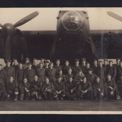 Large group of airmen in front of a Lancaster