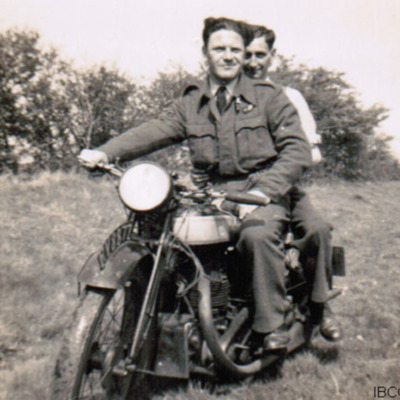 Two airmen on a motorbike