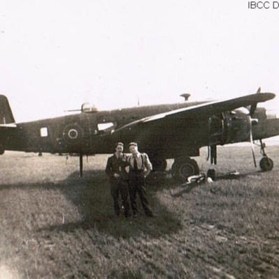 Two airmen in front of a RAF Mitchell