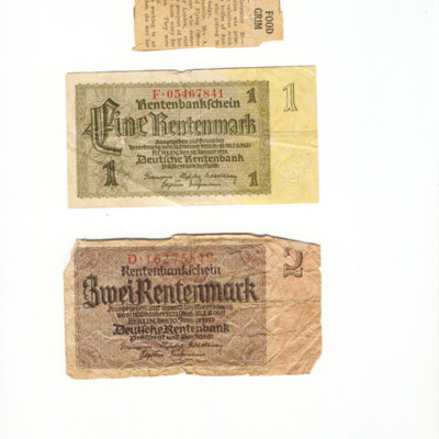 Newspaper cutting and German bank notes