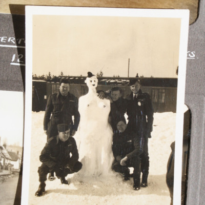 Five airmen and a snowman