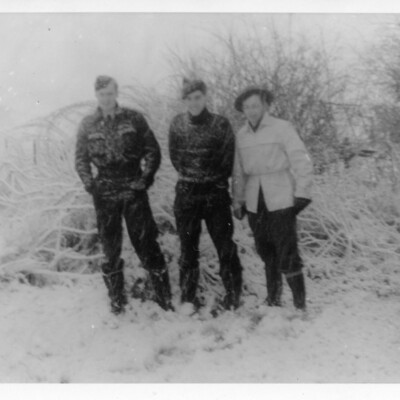 Three airmen in snow