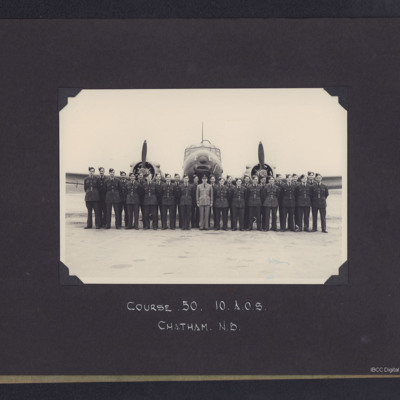 Twenty- seven airmen in front of an Anson
