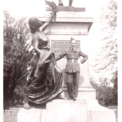 Airman standing on a monument