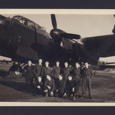 Eleven airmen in front of Lancaster