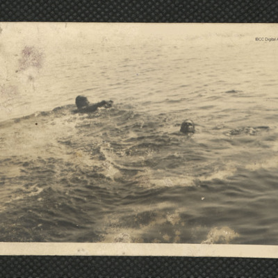 Two men swimming