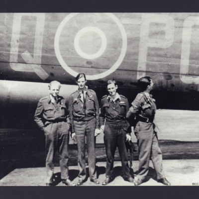 Four airmen standing by a Lancaster 