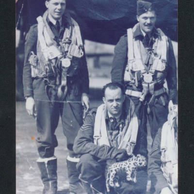 Three airmen and mascot