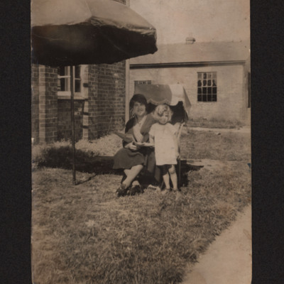 Woman in deckchair with child