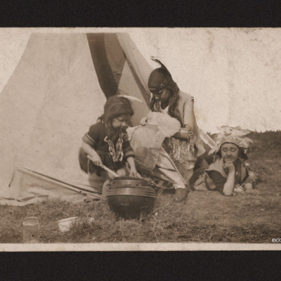 Three children playing as Native Americans