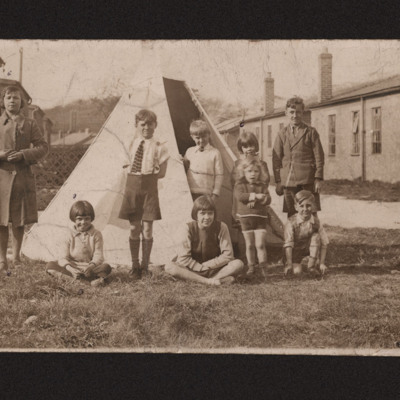 Group of children outside a teepee tent