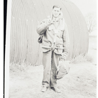 Airman in front of Nissen hut
