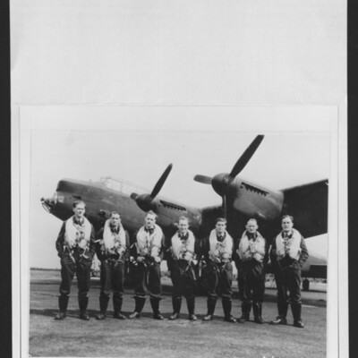 Seven aircrew in front of a Lancaster