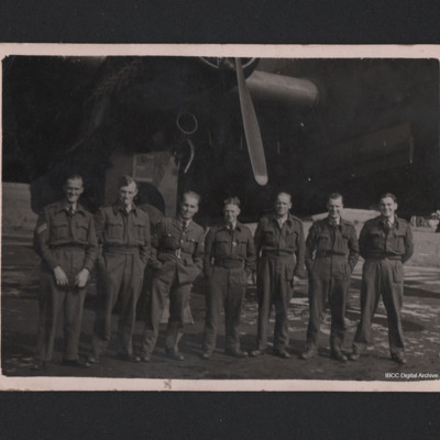 Seven groundcrew in front of a Halifax
