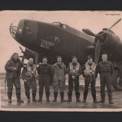 Seven aircrew in front of a Halifax