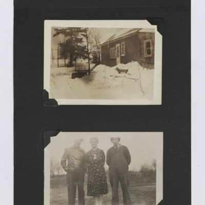 House in the snow and three people