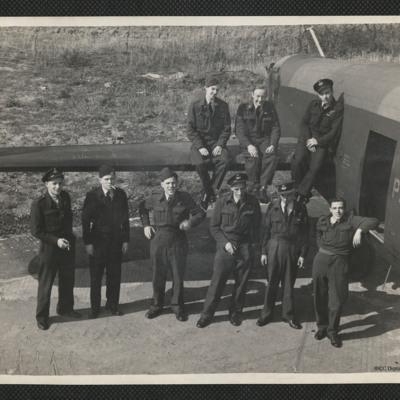 Nine airman by the tail of a Lancaster