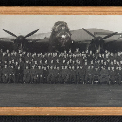 Large group of airmen in front of a Lancaster