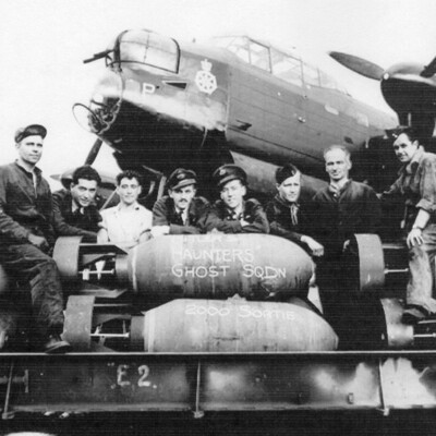Eight  Air and Ground Crew and a Bomb Load