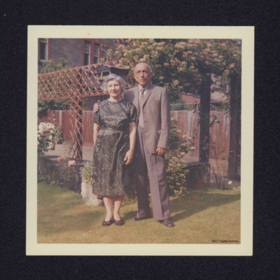 Man and woman standing in a garden