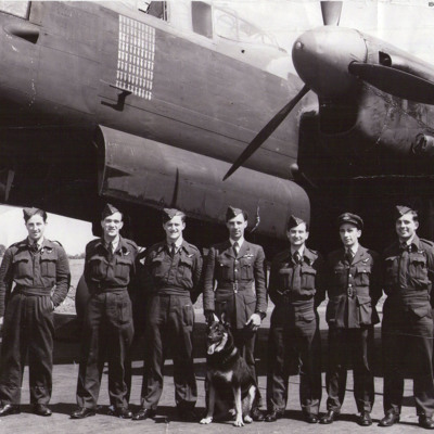 Seven aircrew in front of a Lancaster