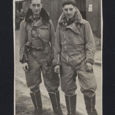 George Holmes and an airman standing in front of a hut