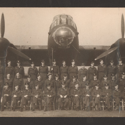 Squadron aircrew personnel in front of Lancaster