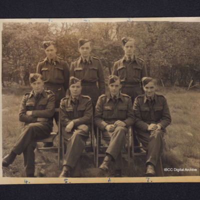 Seven airmen in a field