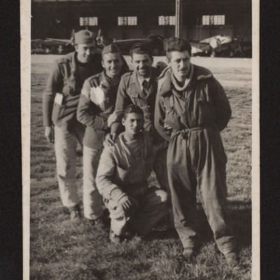 Paolo Troglio and personnel in front of an hangar