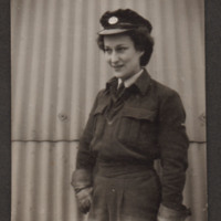 Member of the Woman&#039;s Auxiliary Air Force  in front of a Nissen hut