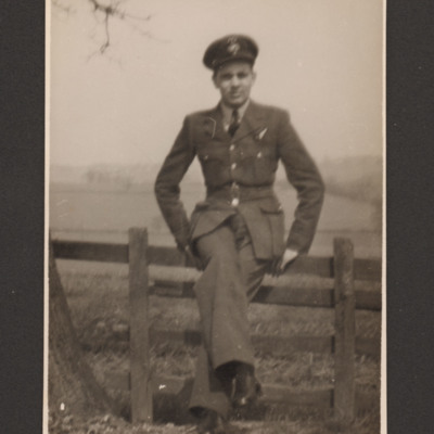 Charles Godfrey sitting on a fence