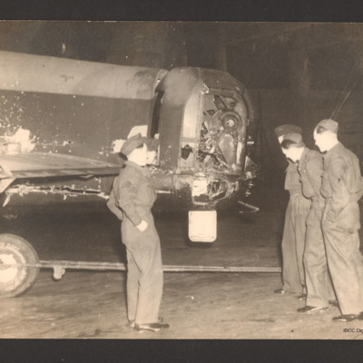 Reg Mullins and crew inspecting  Lancaster&#039;s damaged rear turret
