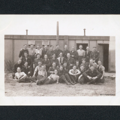 Group of airmen in front of a building