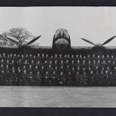 Squadron personnel in front of Lancaster